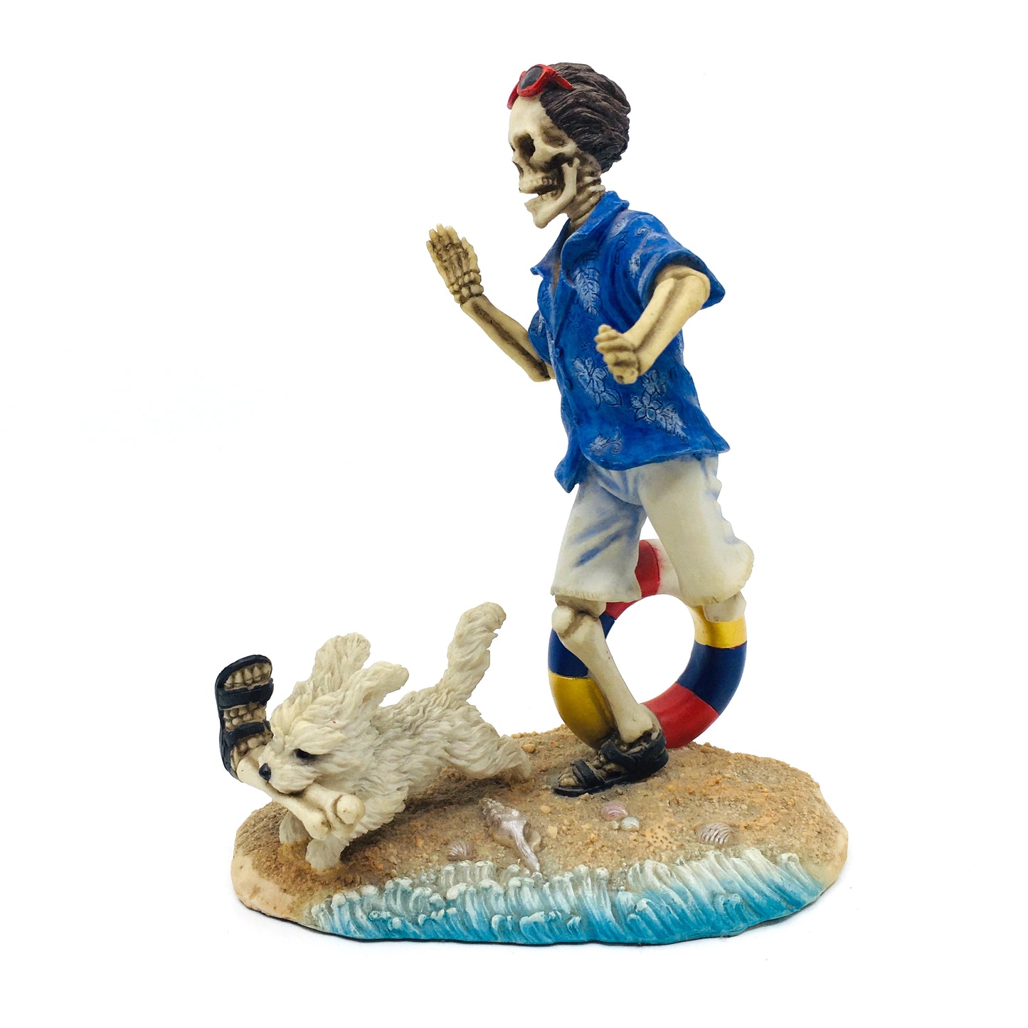 Skeleton Beach Man Making Fetch for His Dog Figurine
