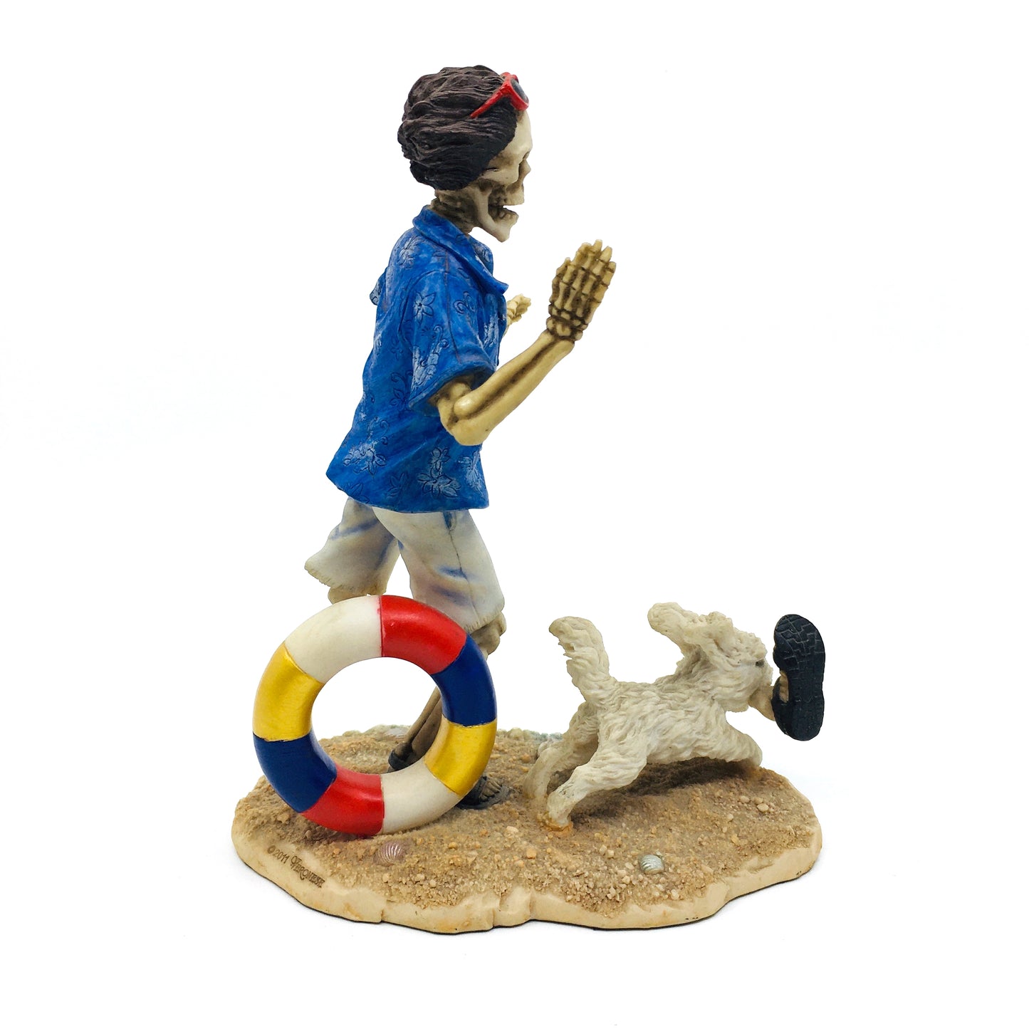 Skeleton Beach Man Making Fetch for His Dog Figurine