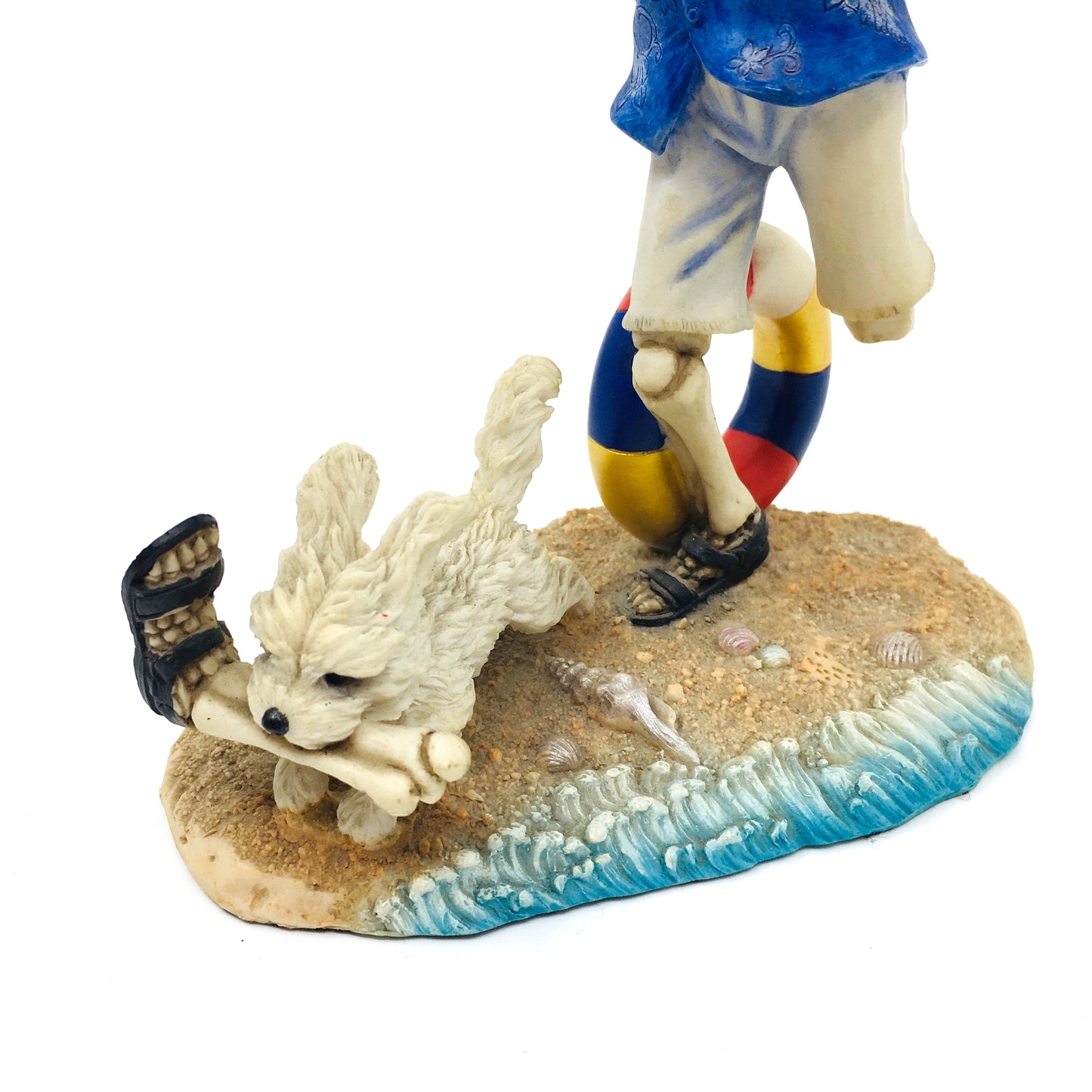 Skeleton Beach Man Making Fetch for His Dog Figurine