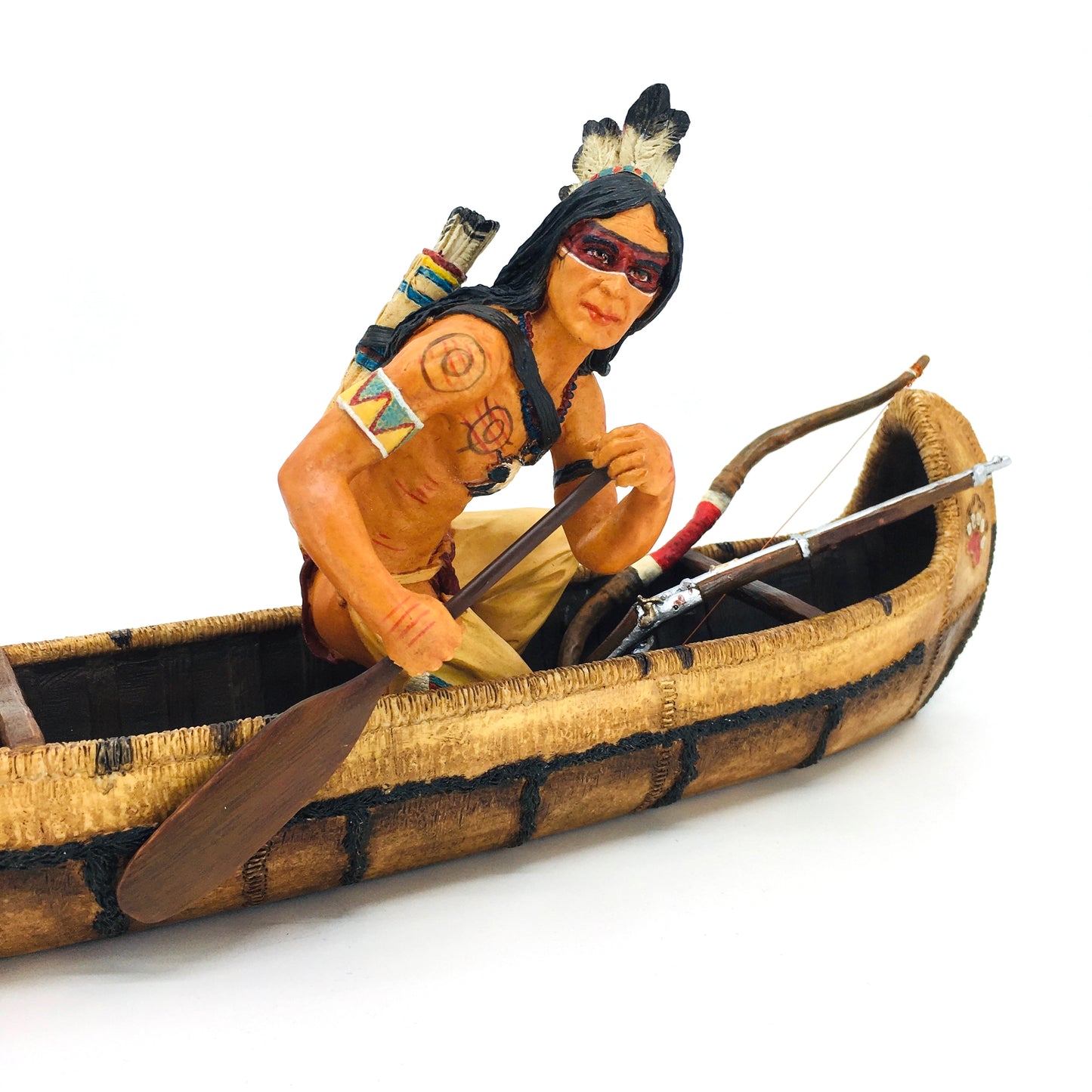 Native American Indian Warrior Figurine in a Canoe