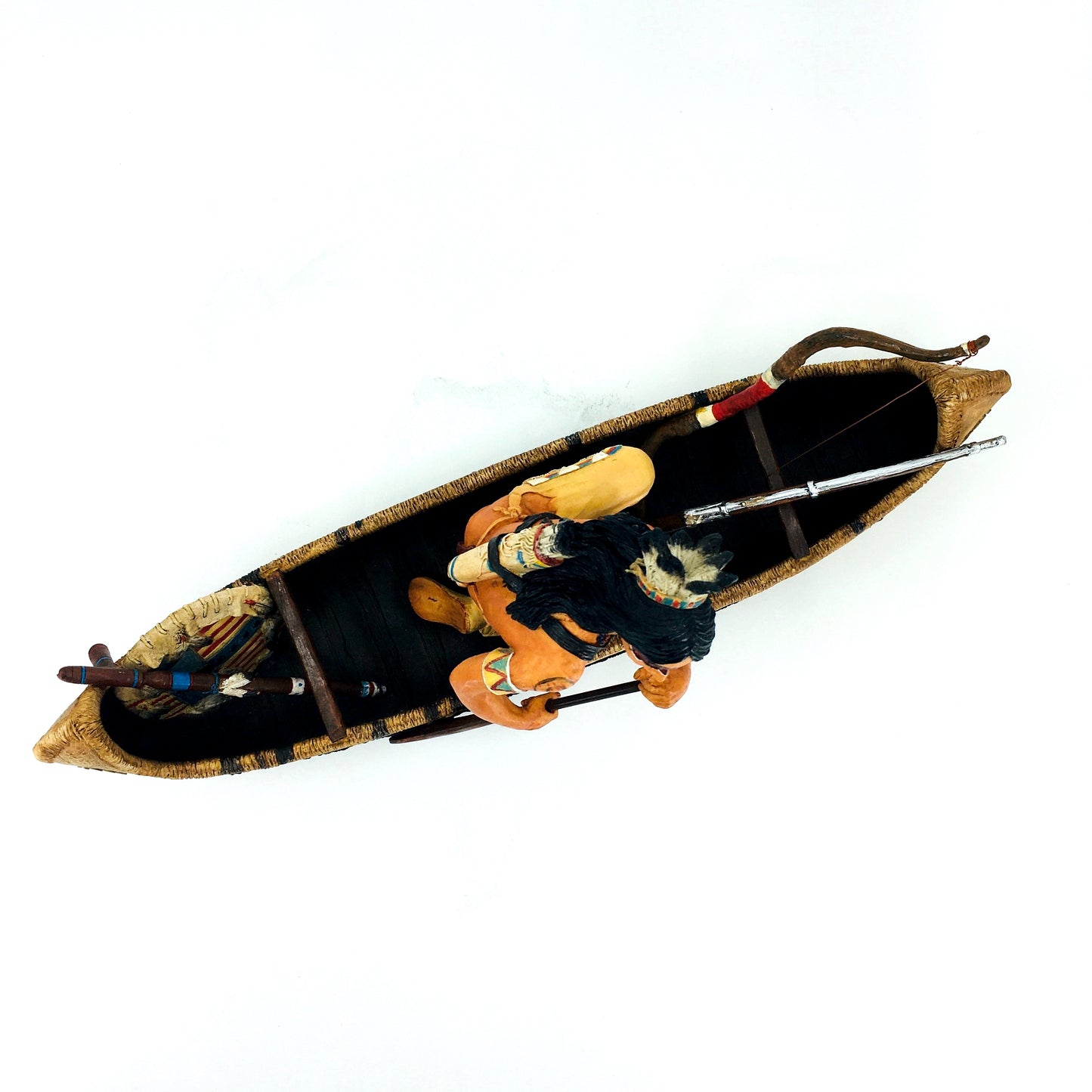 Native American Indian Warrior Figurine in a Canoe